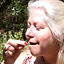 Kathy Crane samples an Oregon grape, a food that is popul...